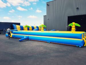 location du ventriglise Palmiers double pistes, jeu d'eau gonflable pour enfants et adultes sur Toulouse et toute la France proposé par id2loisirs