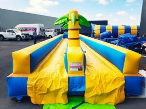 location du ventriglise Palmiers double pistes, jeu d'eau gonflable pour enfants et adultes sur Toulouse et toute la France proposé par id2loisirs